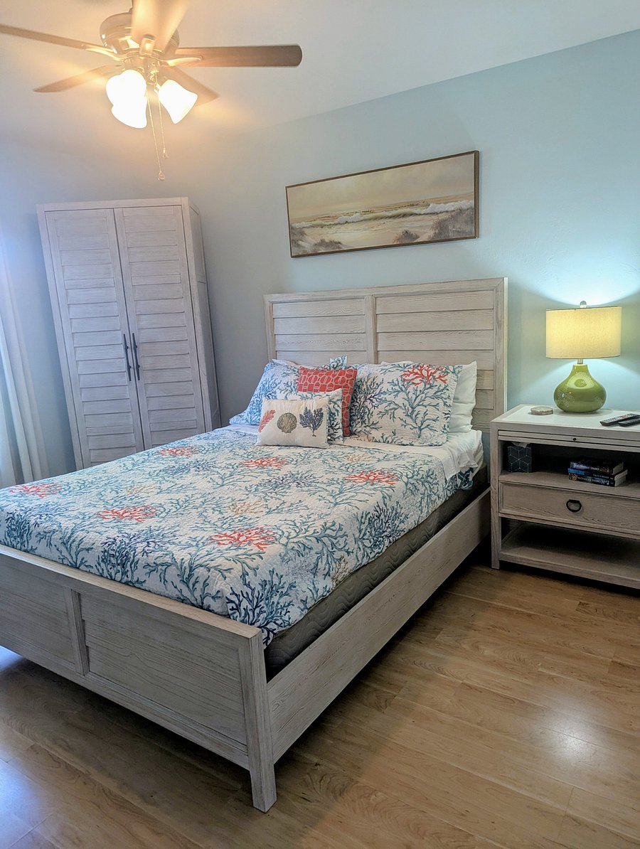 Primary Bedroom, Queen bed, Armoire, ceiling fan, nightstand, lamp