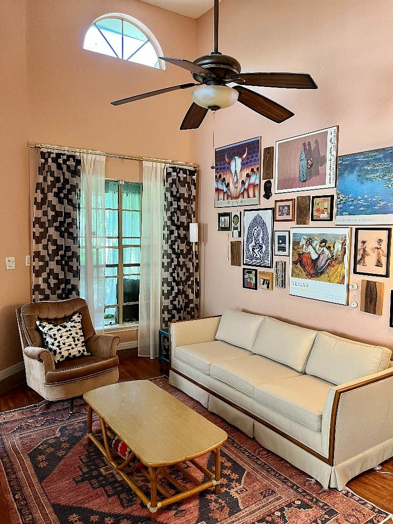 Living room with vaulted ceilings and plenty of seating.