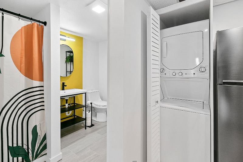 Bathroom, alongside convenient in-unit washer and dryer
