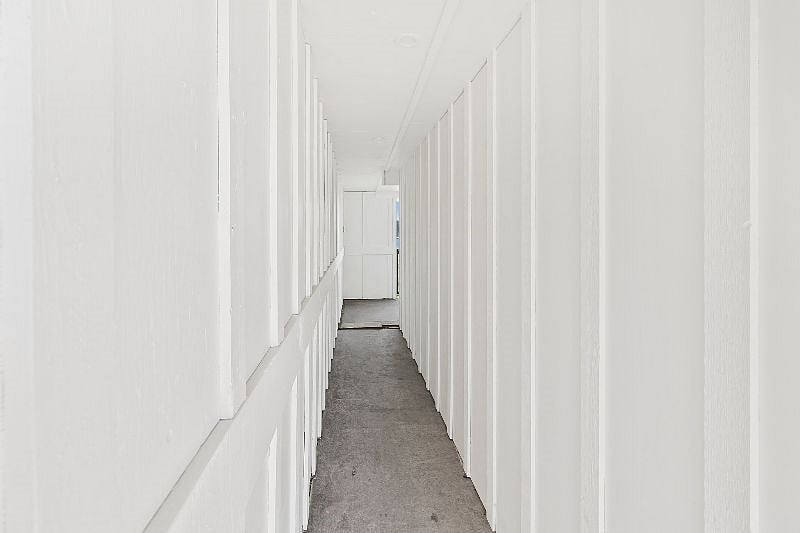 Safe, well-lit breezeway entrance to apartment with motion-sensor lighting