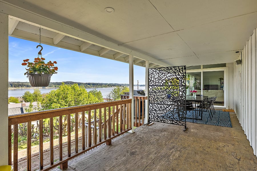 Breezeway entry leads to stairs that cross with the deck belonging to the main house. Private entrance to the apartment is below.