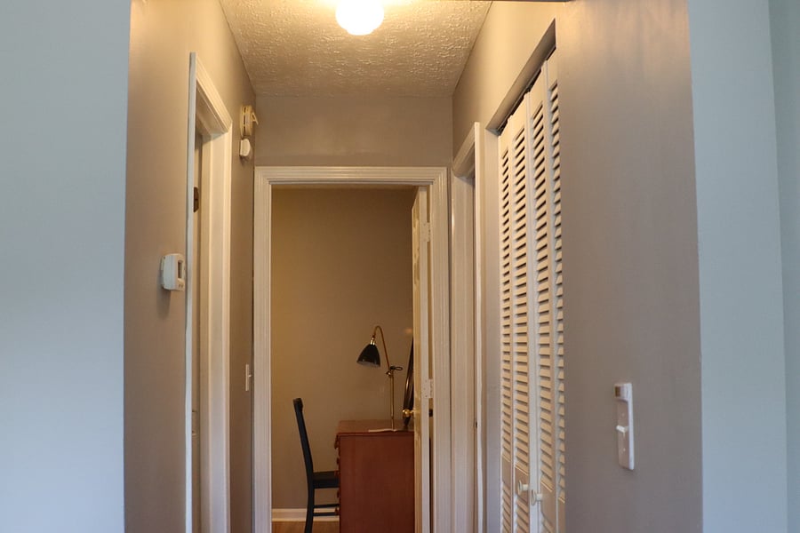 Hallway view looking from the front door towards the secondary bedroom.