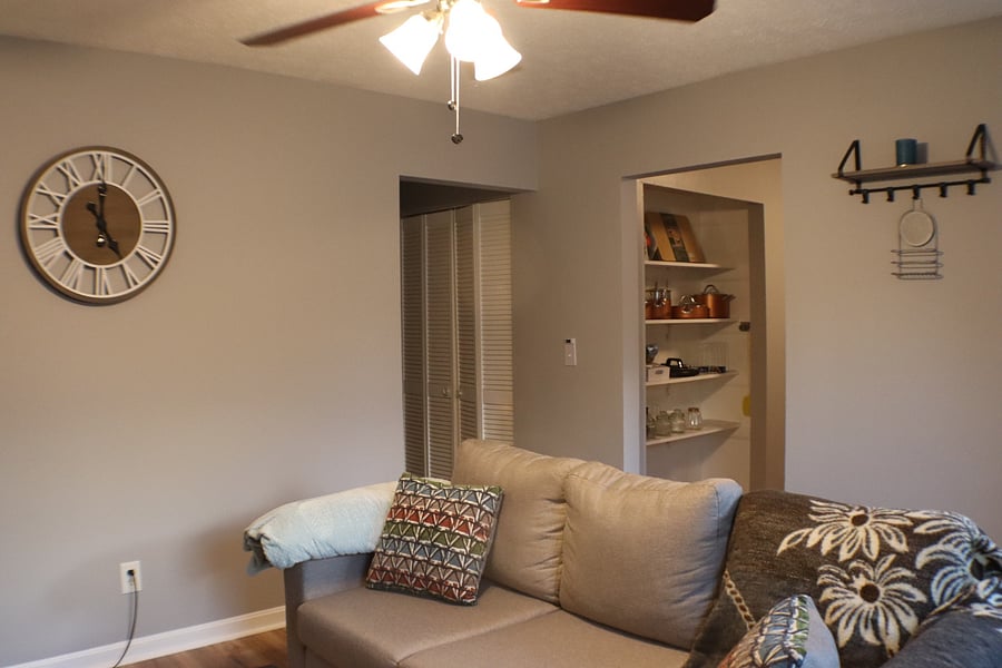 Living room with view of kitchen pantry