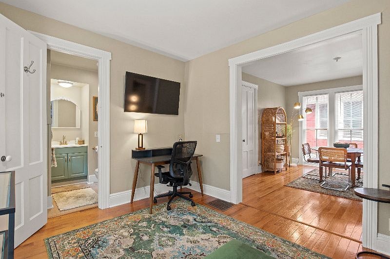 Living room featuring Smart TV and desk for workspace