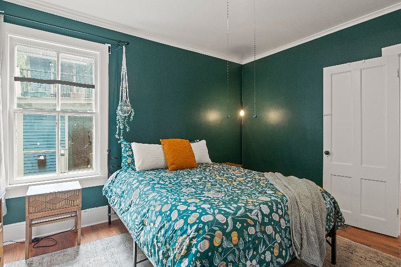 Bedroom view with two large closets behind