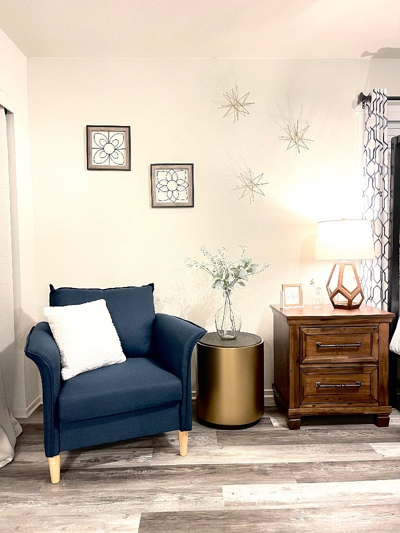 This is your beautiful master bedroom, with very comfortable mattress, beautiful dressing chair, full size Ashely dresser, nightstand with power ports, 14' of closet space, and a full size dressing mirror.