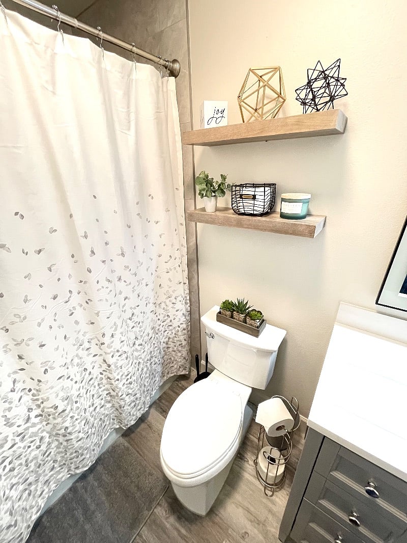 Theres nothing like getting ready in a beautiful bathroom with floor to ceiling tile shower, lighted and heated mirror, and automatic moisture sensing fan.