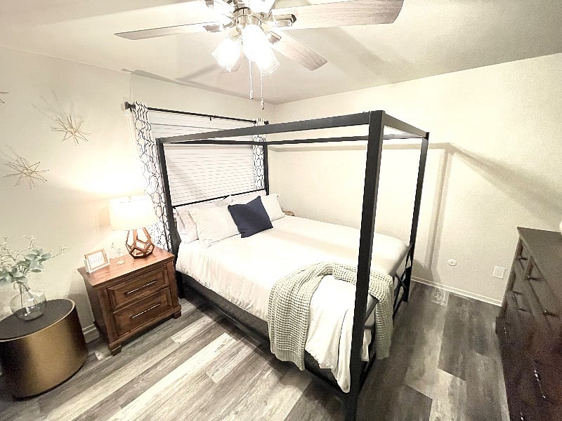 This is your beautiful master bedroom, with very comfortable mattress, beautiful dressing chair, full size Ashely dresser, nightstand with power ports, 14' of closet space, and a full size dressing mirror.