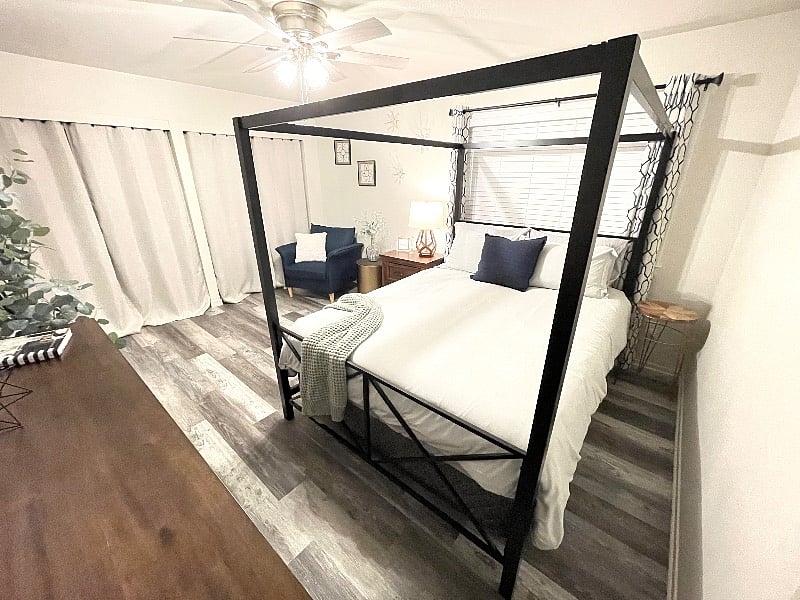 This is your beautiful master bedroom, with very comfortable mattress, beautiful dressing chair, full size Ashely dresser, nightstand with power ports, 14' of closet space, and a full size dressing mirror.