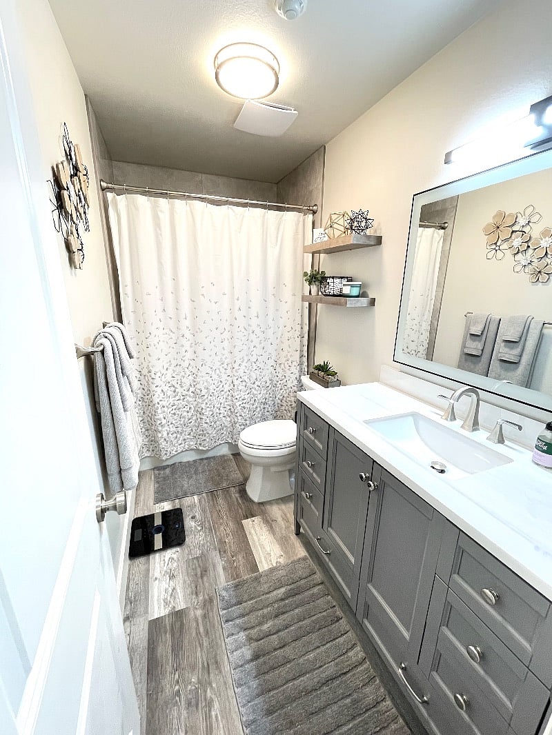 Theres nothing like getting ready in a beautiful bathroom with floor to ceiling tile shower, lighted and heated mirror, and automatic moisture sensing fan.
