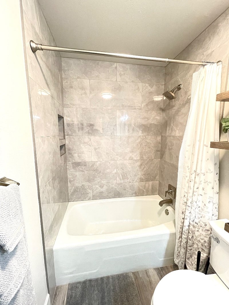 Theres nothing like getting ready in a beautiful bathroom with floor to ceiling tile shower, lighted and heated mirror, and automatic moisture sensing fan.