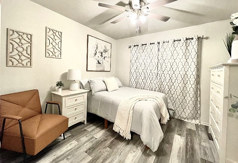 Your beautiful front bedroom with a super comfortable mattress, and comfortable dressing chair.