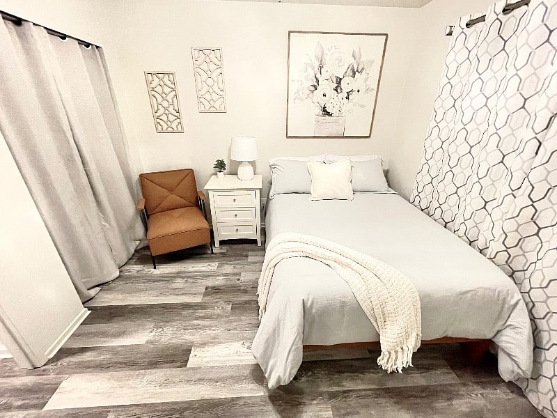 Your beautiful front bedroom with a super comfortable mattress, and comfortable dressing chair.