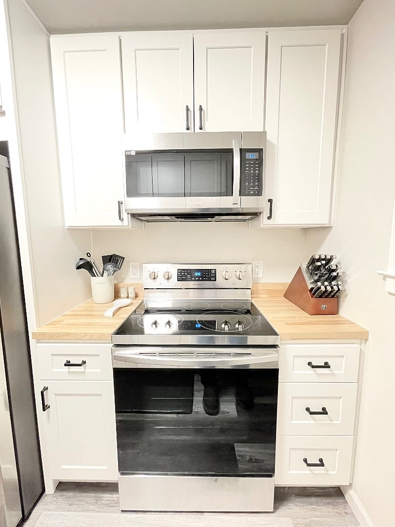You have a beautiful kitchen wit all stainless steel appliances, touchless faucet, sink with integrated cutting board and drying wrack, and dishwasher.