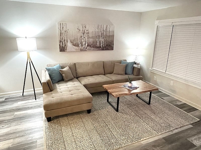 Your beautiful living room with a comfortable Ashley couch with build in chase lounge.