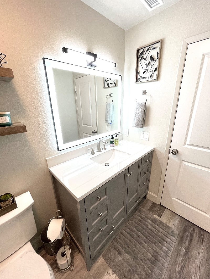 Theres nothing like getting ready in a beautiful bathroom with floor to ceiling tile shower, lighted and heated mirror, and automatic moisture sensing fan.