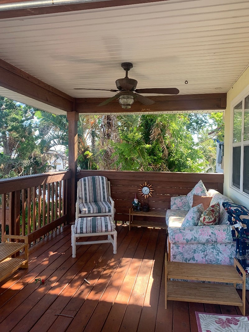 Outside deck, partially covered with a ceiling fan and an amazing view