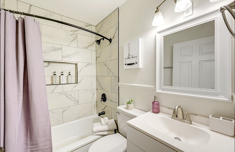 Refresh and rejuvenate in this modern bathroom, with a bright vanity area so you can get ready in style. With lotion and potion space!