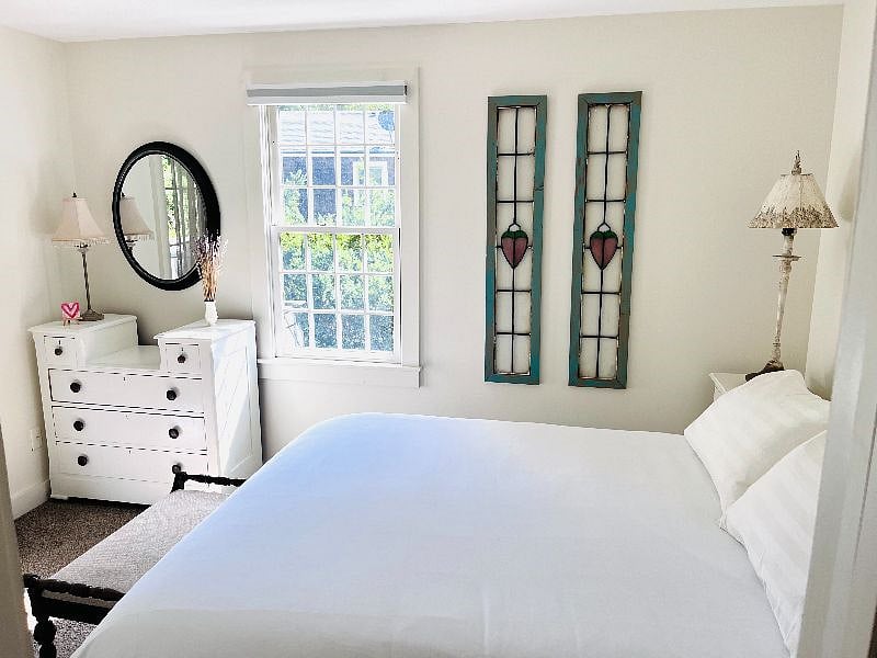 Queen-size bed, bureau, and full closet.