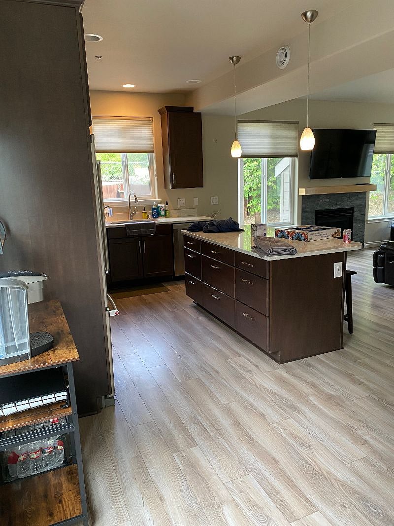 Fully stocked kitchen with pots, pans, dishes, silverware, glasses, keurig coffee maker.