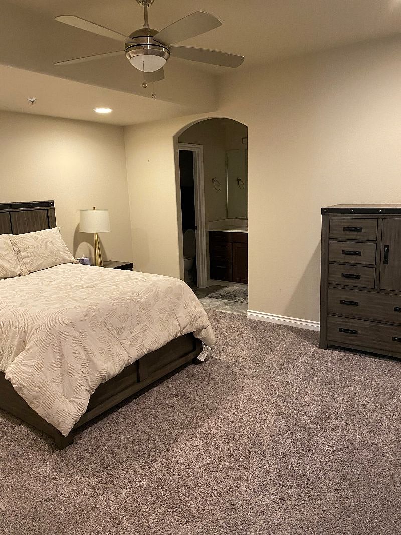 Large master bedroom with full size bed.