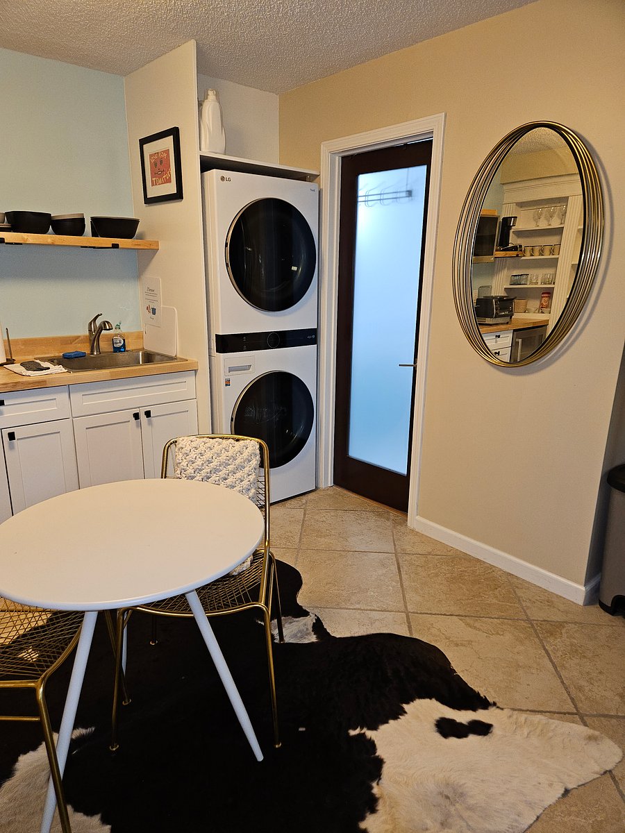 Bath entry adjacent to washer/dryer.view