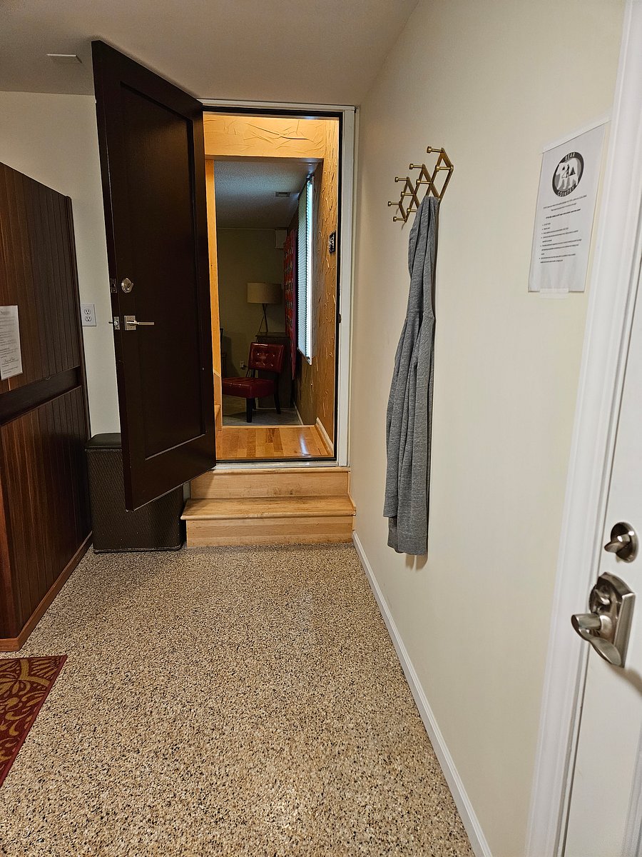 View looking into remaining suite from office/sauna room. All rooms pictured are private for our guests.