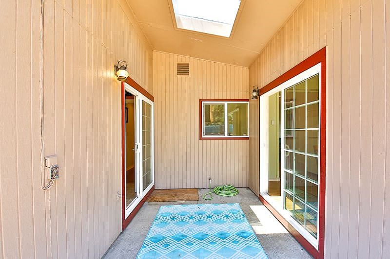 Another extra covered patio space with skylight.