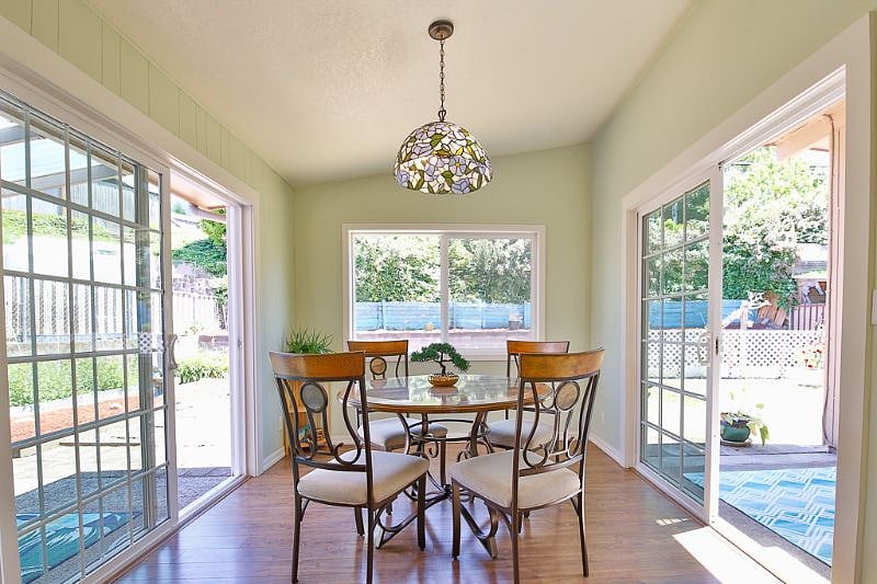 Lots of windows in the dining room for peaceful dining or work space.