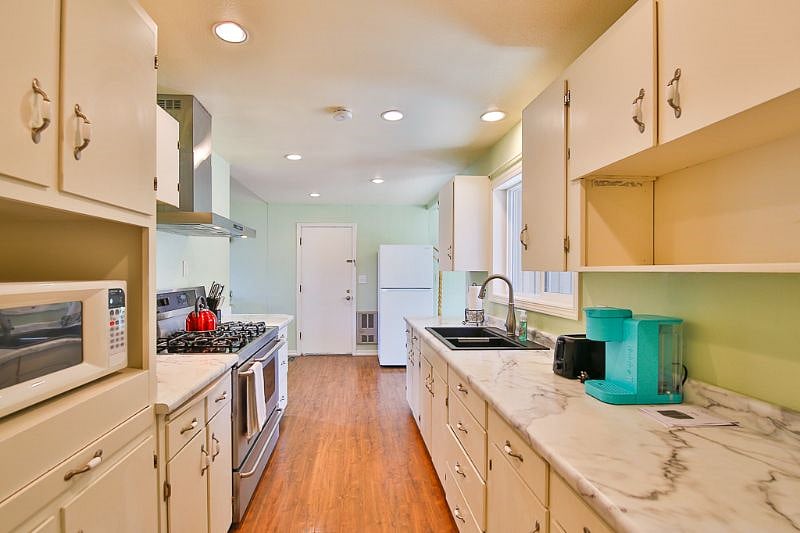 Kitchen opens out to the living space and dining.