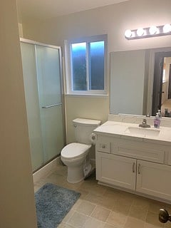 Private en-suite bath features large walk-in shower and cabinets for storage.