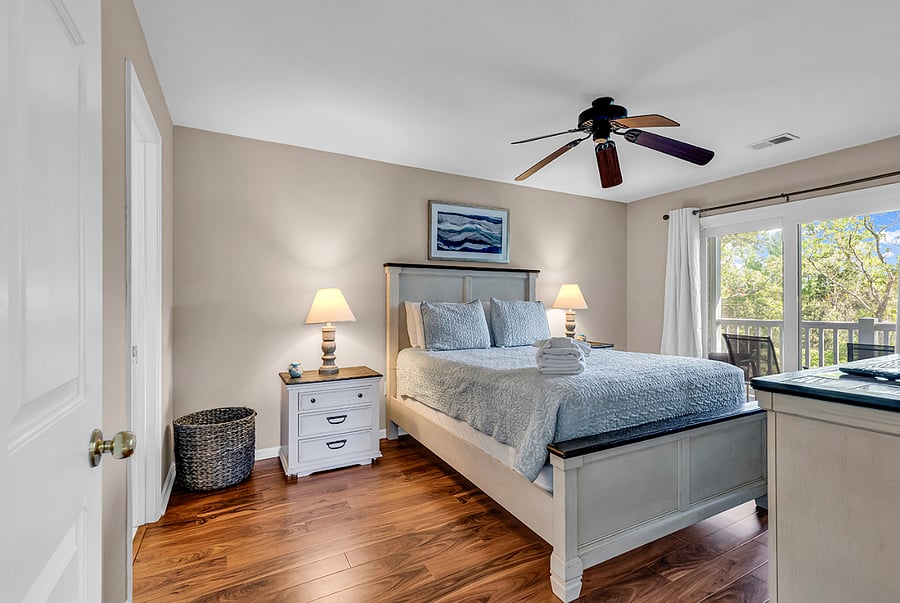 Primary bedroom with balcony access