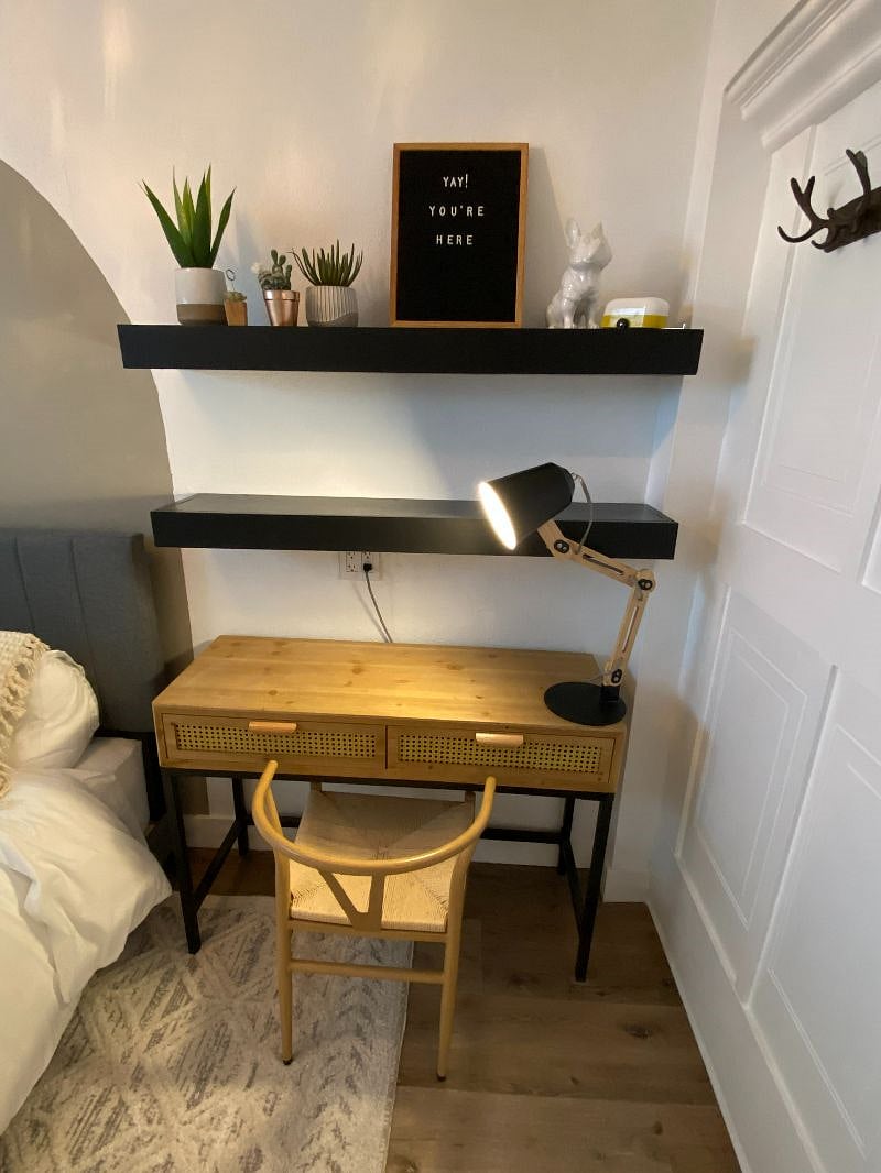 Desk space in bedroom with shelves