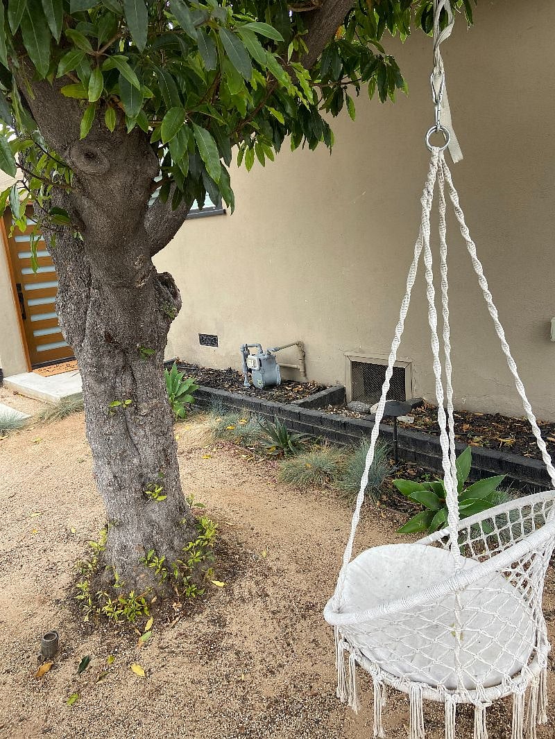 Tree swing outdoor front of unit