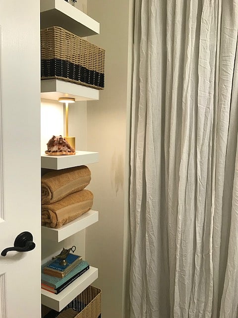 Shelving and bins for bath storage.