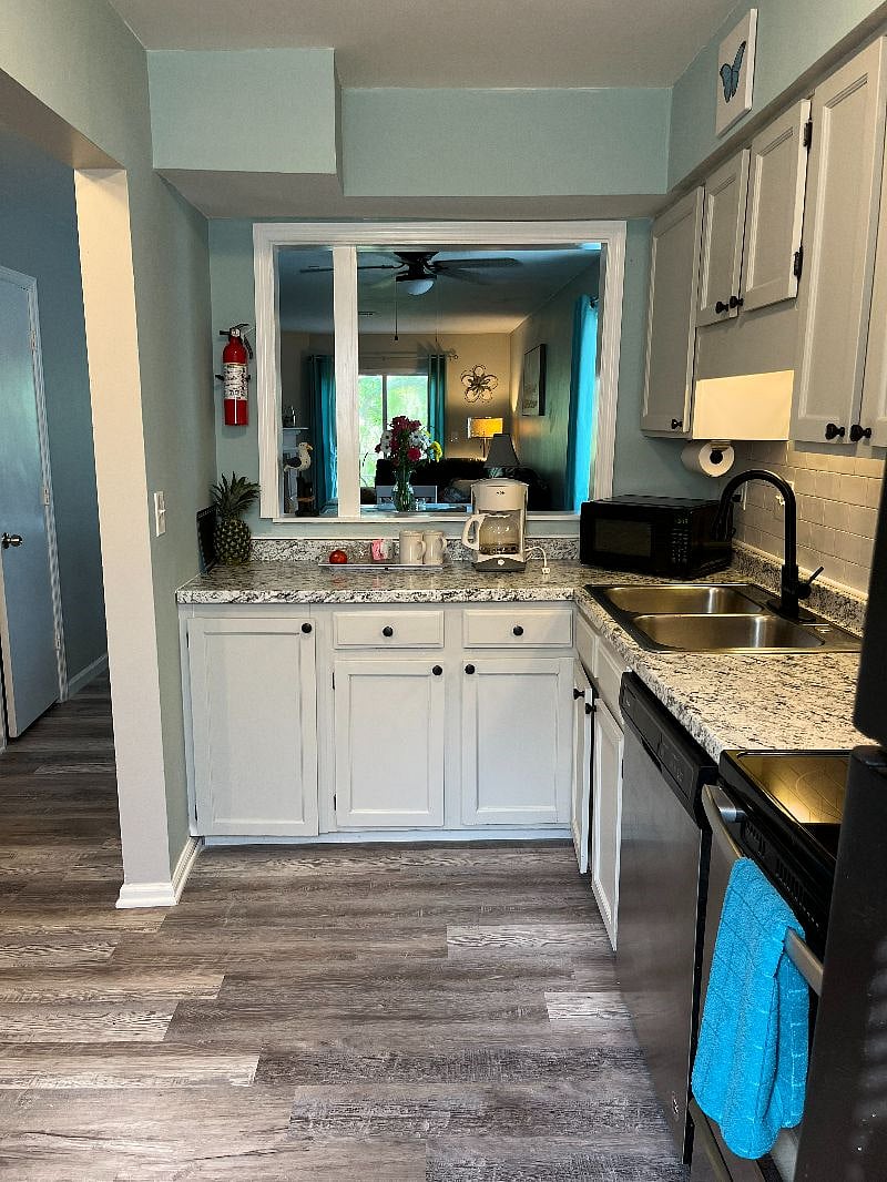 Well equipped kitchen with all dishes, silverware, pots, pans, cooking utensils