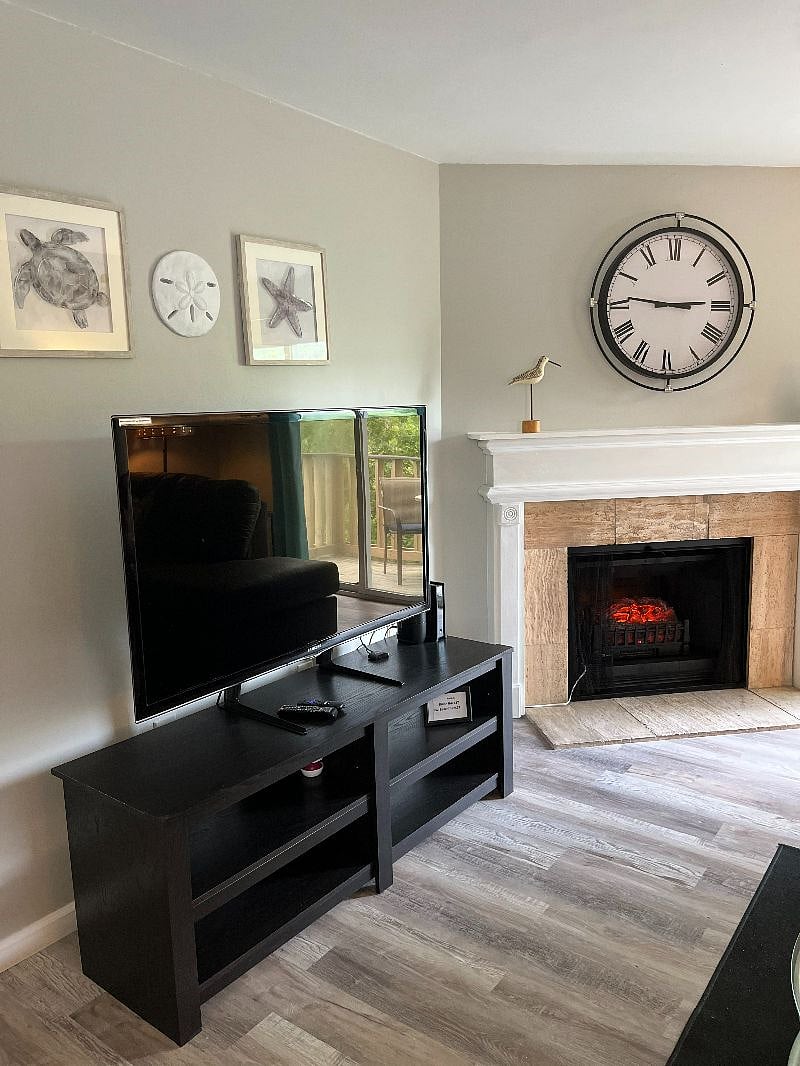Living Room Clock and Roku TV Electric Fireplace for those FEW cool nights!!!