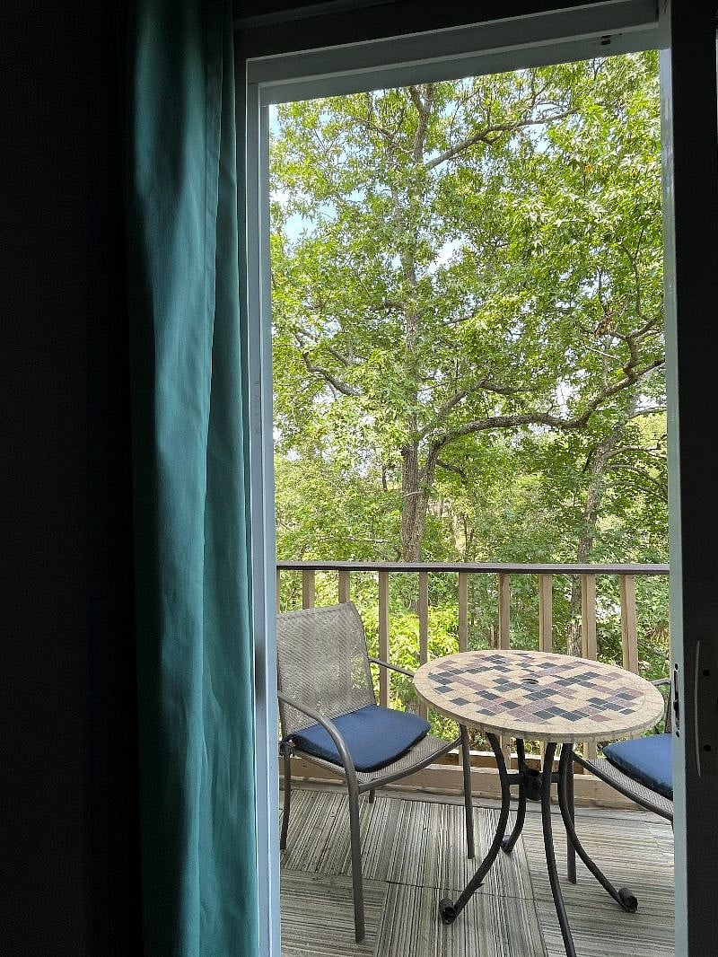 Looking out at deck from Living Room onto back deck overlooking the canal.