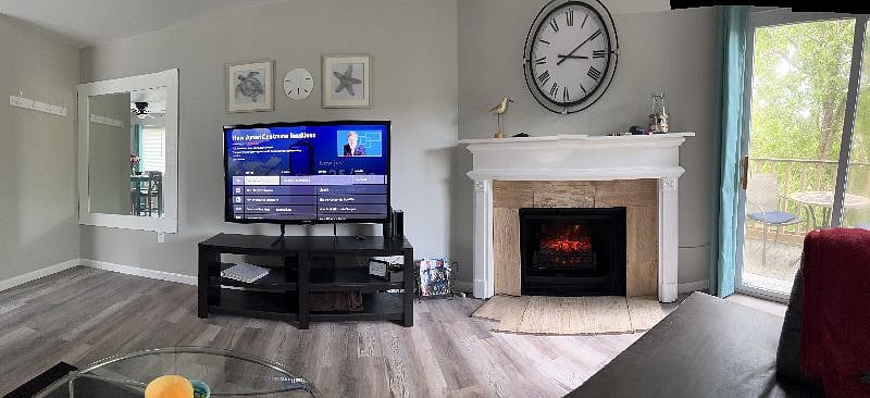 Living room with electric fireplace.
Roku TV with streaming capabilities!