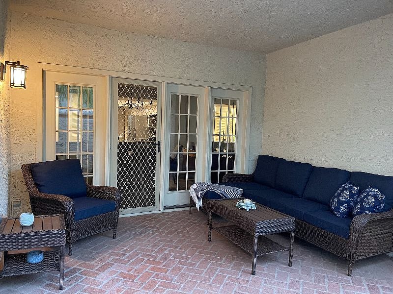 Patio furnished with comfortable sofa and chair