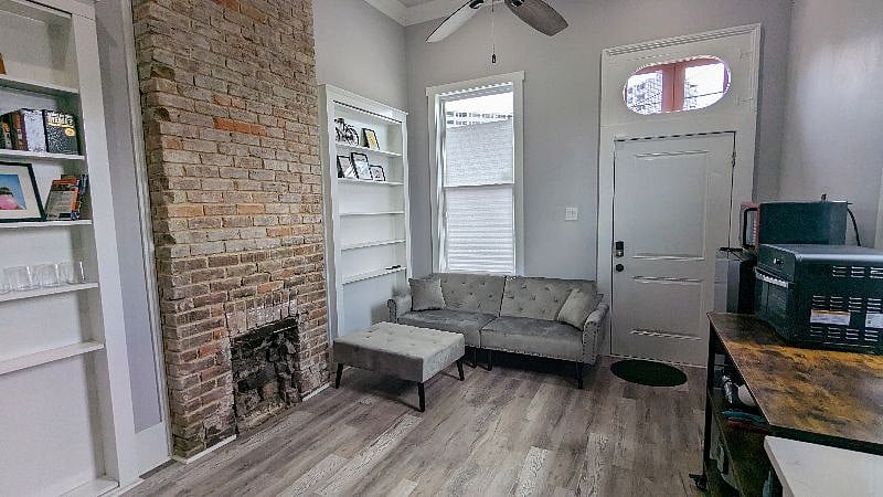 Living Space includes couch and built in shelves. Unit has own security keypad for additional security. Bistro table and two chairs will be added.