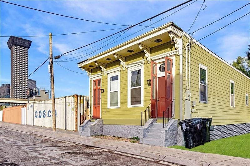 Rental unit is on the left side of the double shotgun with its own entrance. Next door is Central City BBQ.