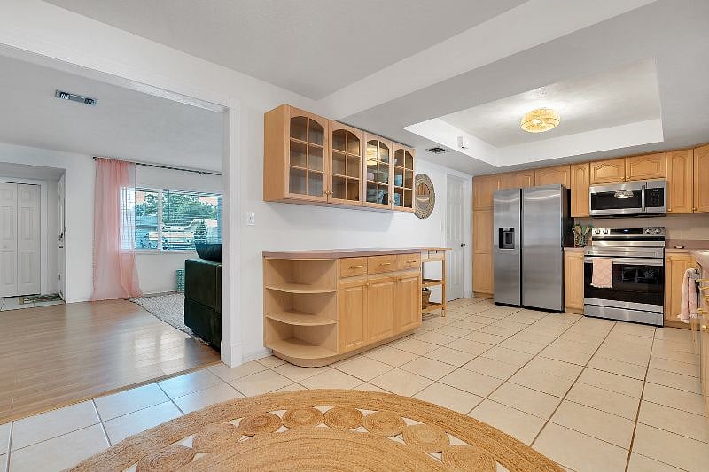 Wide, spacious kitchen with brand new appliances and fully stocked with all you need to make meals! Extra FULL SIZE fridge in the garage!