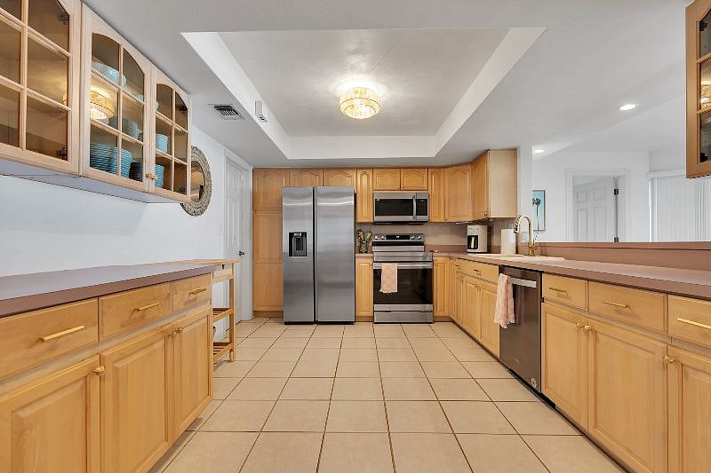 Wide, spacious kitchen with brand new appliances and fully stocked with all you need to make meals! Extra FULL SIZE fridge in the garage!