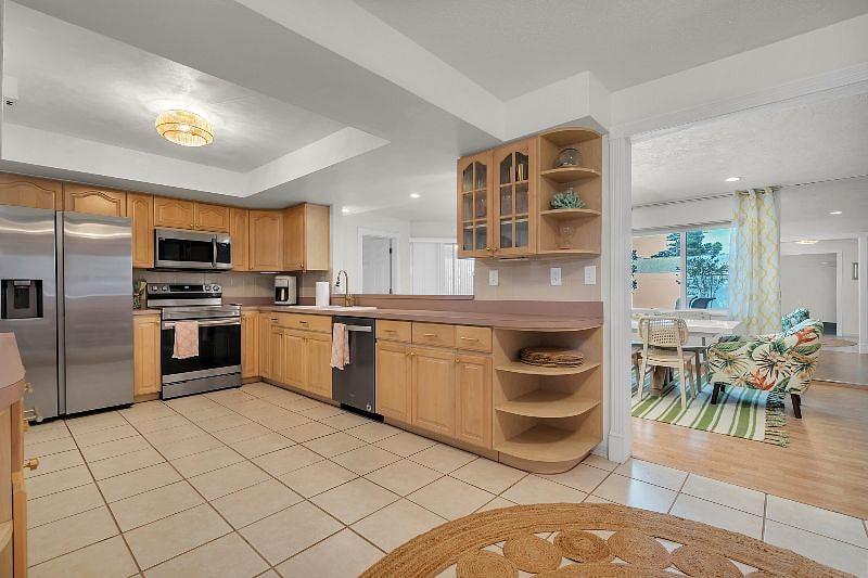 Wide, spacious kitchen with brand new appliances and fully stocked with all you need to make meals! Extra FULL SIZE fridge in the garage!
