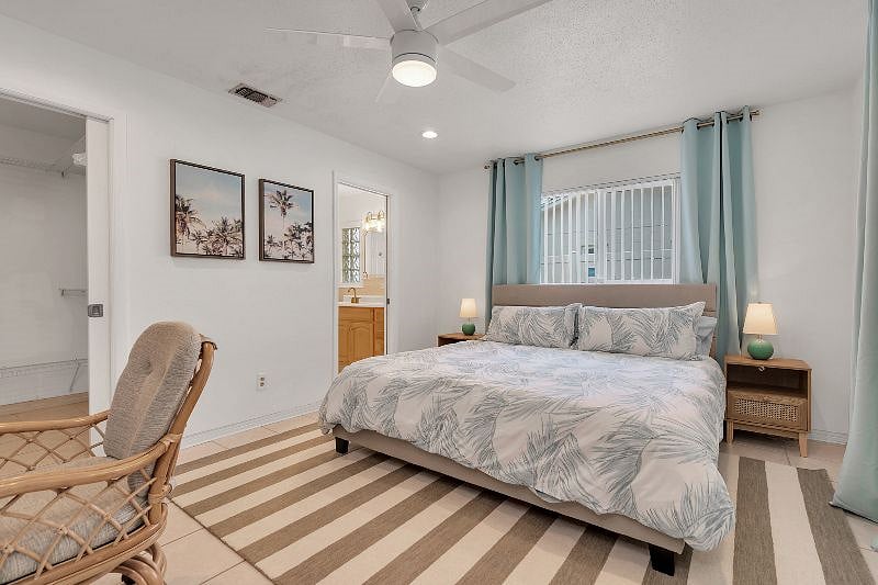 King Bedroom! With a desk and 55" TV, and a huge walk-in closet! Also has a pack n play, and private bathroom.
