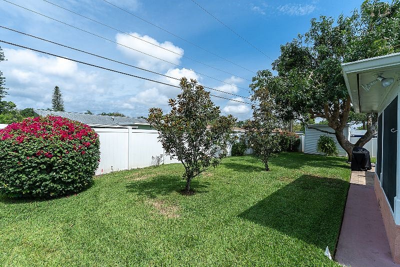 FULLY FENCED in, private back yard with Hot tub, grill + table!