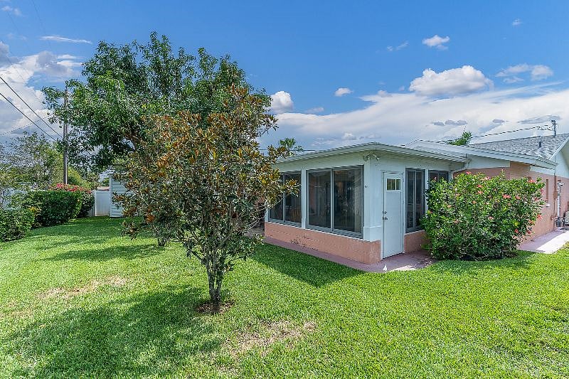 FULLY FENCED in, private back yard with Hot tub, grill + table!