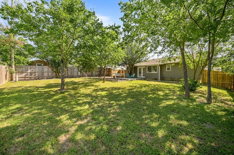 large, dog-friendly yard with privacy fence