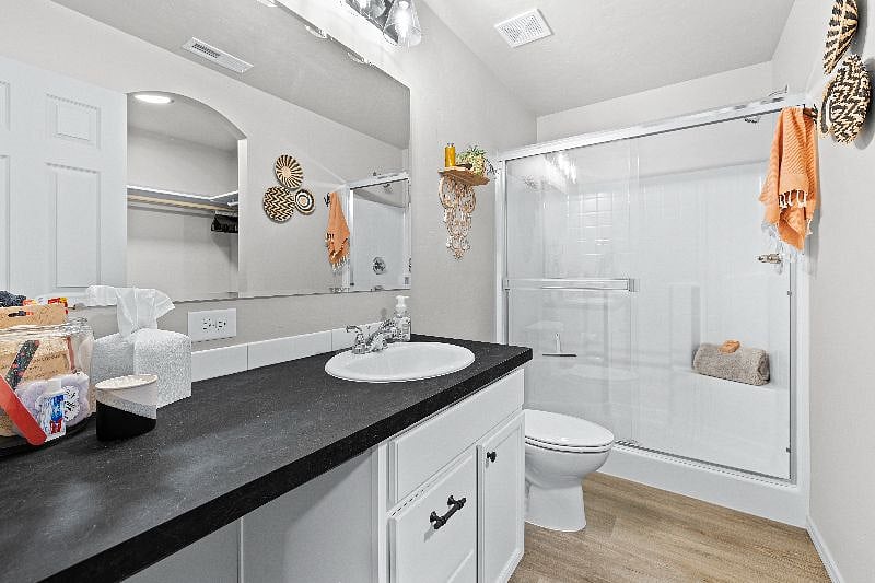 Spacious en suite with walk in shower and access to large walk-in closet. Towels, rugs and starter amenities provided for your use